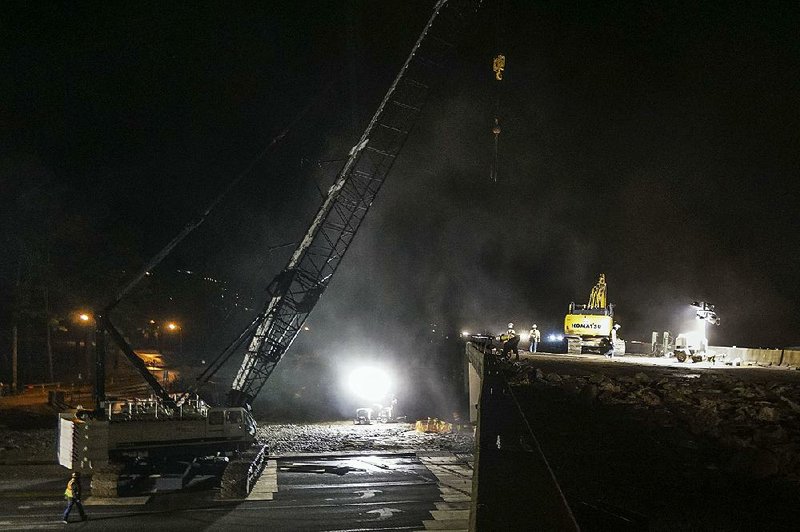 Construction on the Interstate 630 overpass continued throughout the night Friday in Little Rock.