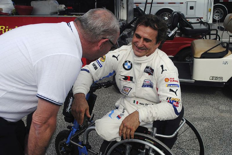 Alex Zanardi (right) is preparing to drive in the Rolex 24 Hours of Daytona later this month. The race will be Zanardi’s first since losing both legs in a 2001 accident in Germany.
