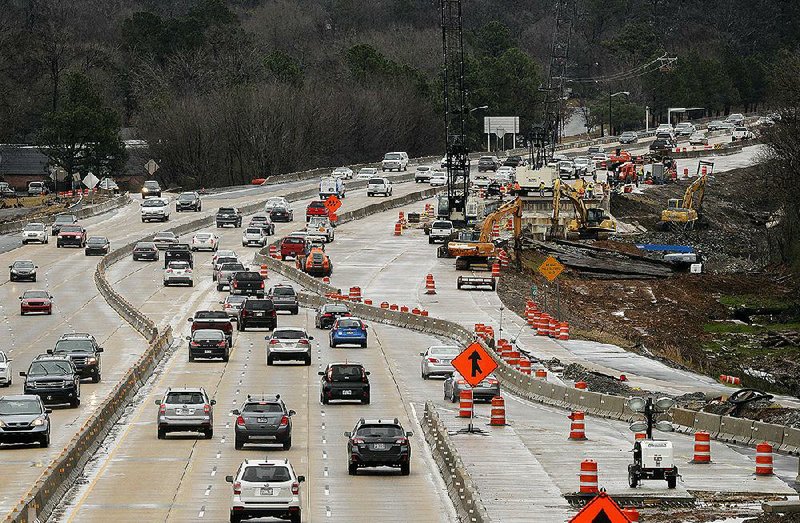 FILE — Traffic flows along Interstate 630 on Jan. 6, 2019, as construction crews work on the widening project. 