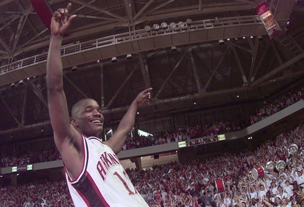 Kareem Reid celebrates following Arkansas' 1999 upset of Kentucky at Bud Walton Arena.