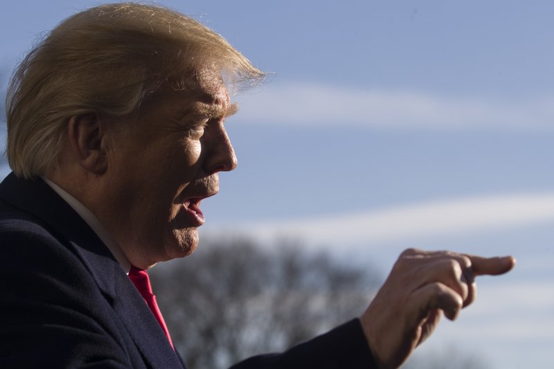 President Donald Trump speaks on the South Lawn of the White House as he walks from Marine One, Sunday, Jan. 6, 2019, in Washington. Trump is returning from a trip to Camp David. (AP Photo/Alex Brandon)