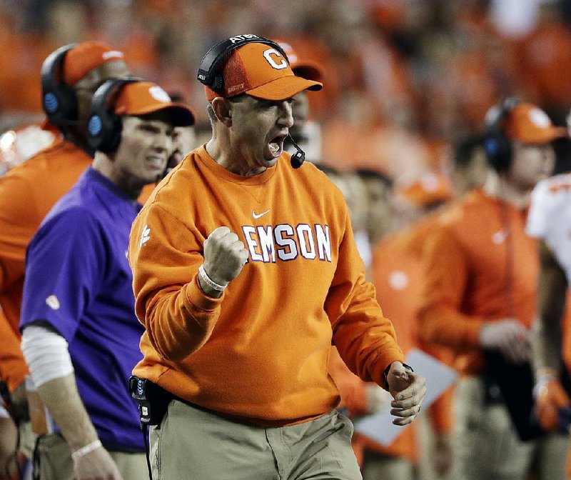 Clemson Coach Dabo Swinney celebrates after a defensive stop by the Tigers during Monday night’s victory over Alabama in the national championship game. Swinney became the 19th coach since 1936 to win multiple national titles. 