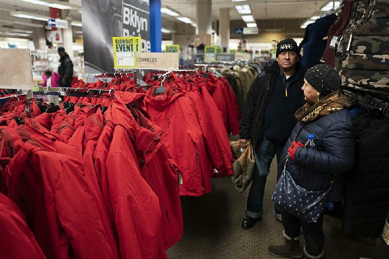 Customers check out the winter coats Monday at a Sears store in New York City. The company is preparing for liquidation even amid  efforts to save it. 