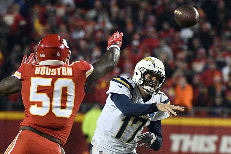 Kansas City linebacker Justin Houston, shown pressuring Los Angeles quarterback Philip Rivers in a home loss to the Chargers, said the Chiefs’ defense is “firing on all cylinders” as they get ready to host the Indianapolis Colts on Saturday in the AFC divisional playoffs. 