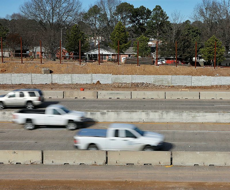 Work continues Tuesday on the Interstate 630 widening project in Little Rock, as seen from Arthur Street in the University Park neighborhood looking north near the Hughes Street overpass.
