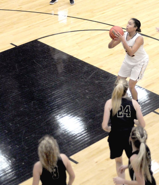 MARK HUMPHREY ENTERPRISE-LEADER Prairie Grove sophomore Jasmine Wynos, pulls the trigger on a jump shot with nobody between her and the goal. Head coach Kevin Froud would have preferred she drive to the basket. Froud emphasizes mental aspects of the game for the 2018-2019 Lady Tiger girls basketball team.