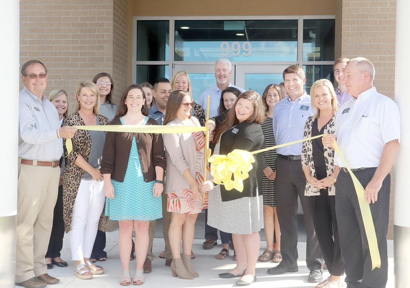 FILE PHOTO Arvest Bank closed its downtown facility and opened a new $3-million branch on Heritage Parkway. Prairie Grove Chamber of Commerce held a ribbon-cutting ceremony for the new building.