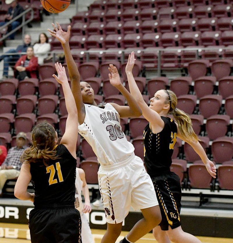 BUD SULLINS SPECIAL TO THE ENTERPRISE-LEADER Siloam Springs junior Jael Harried takes a shot while Prairie Grove defenders Kaylee Elder, left, and Emily Grant defending during Thursday's game in the Siloam Springs Holiday Classic. The Lady Panthers defeated the Lady Tigers 44-29.