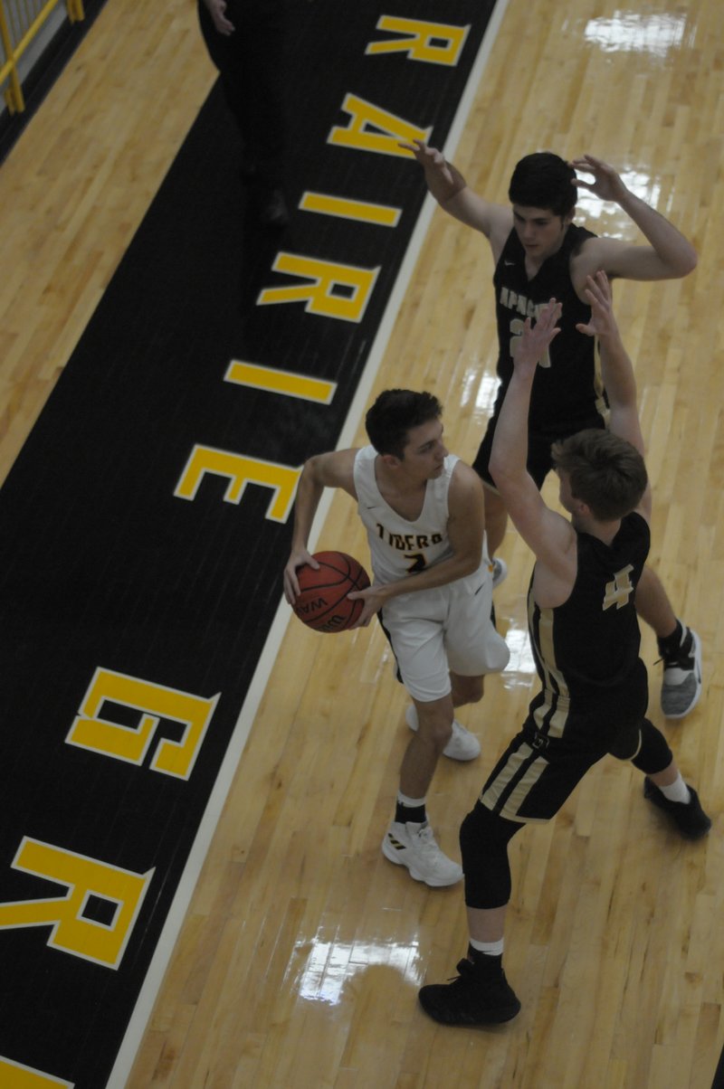 MARK HUMPHREY ENTERPRISE-LEADER Prairie Grove senior Riley Rhodes, shown fending off a half-court trap during nonconference play, scored six points for the Tigers against Pea Ridge.