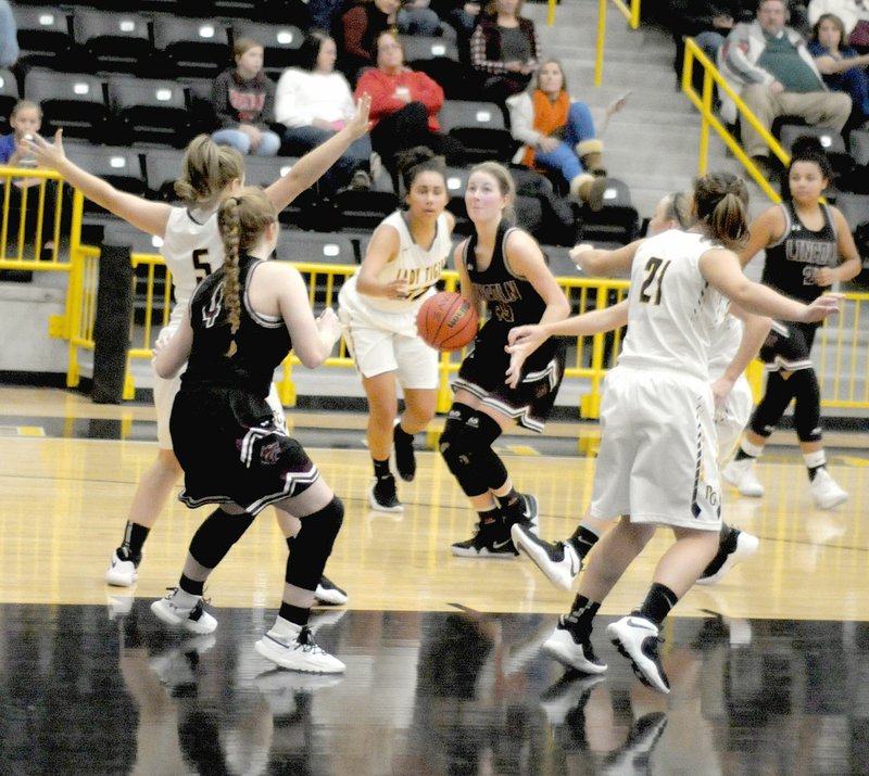 MARK HUMPHREY ENTERPRISE-LEADER Lincoln senior Jessica Goldman, shown driving to the basket against Prairie Grove on Dec. 4, scored 21 points to lead the Lady Wolves past Cedarville, 45-41, in the championship game of the Ozark Holiday Tournament Dec. 29. Goldman was named tourney MVP.