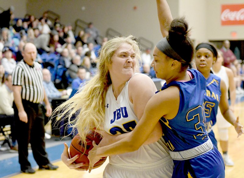 Bud Sullins/Special to the Herald-Leader John Brown freshman Kayla Nelson attempts to make a play last Thursday against Central Christian. Nelson and the Golden Eagles play at Science and Arts (Okla.) this Thursday in Sooner Athletic Conference action.