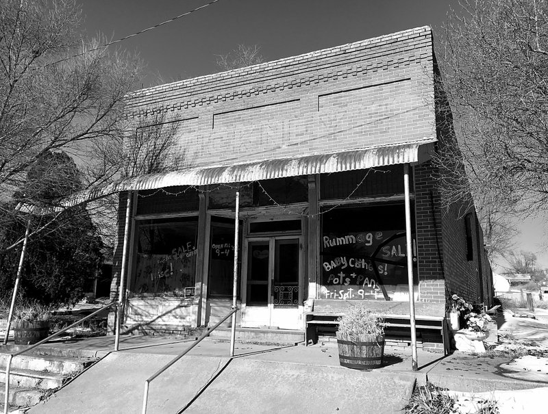 Westside Eagle Observer/RANDY MOLL Though Northwest Arkansas continues to grow, population is declining in some places and many small towns are turning into ghost towns with empty store fronts and hotels like these in Edmond, Kan.