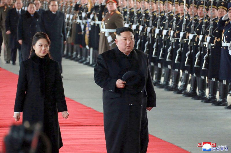 In this Monday, Jan. 7, 2019, photo provided on Tuesday, Jan. 8, 2019, by the North Korean government, North Korean leader Kim Jong Un walks with his wife Ri Sol Ju at Pyongyang Station in Pyongyang, North Korea, before leaving for China. While President Donald Trump waits in the wings, Kim arrived in Beijing on Tuesday for his fourth summit with China&#x2019;s Xi Jinping, yet another nod to the leader Kim most needs to court as he tries to undermine support for international sanctions while giving up little, if any, ground on denuclearization. Independent journalists were not given access to cover the event depicted in this image distributed by the North Korean government. The content of this image is as provided and cannot be independently verified. Korean language watermark on image as provided by source reads: &quot;KCNA&quot; which is the abbreviation for Korean Central News Agency. (Korean Central News Agency/Korea News Service via AP)