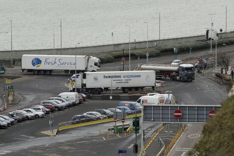 Trucks take part in a no-deal Brexit test, by driving through Dover near the ferry port whilst testing a route from Manston Airfield where 6,000 trucks could be parked as an overspill customs option in south east England, Monday, Jan. 7, 2019.  (AP Photo/Matt Dunham)