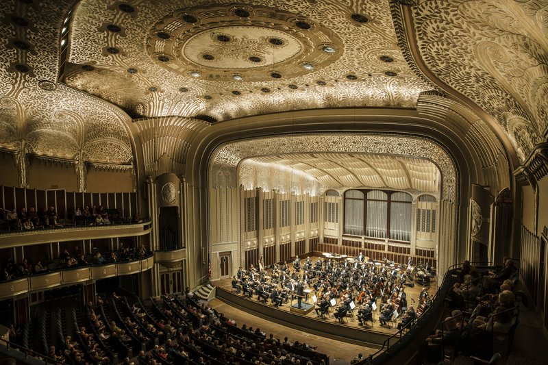 The Cleveland Orchestra plays to a rapt audience beneath the intricate aluminum ceiling at Severance Hall. The hall is a bright spot in a city on the rebound from a decades-long slump.