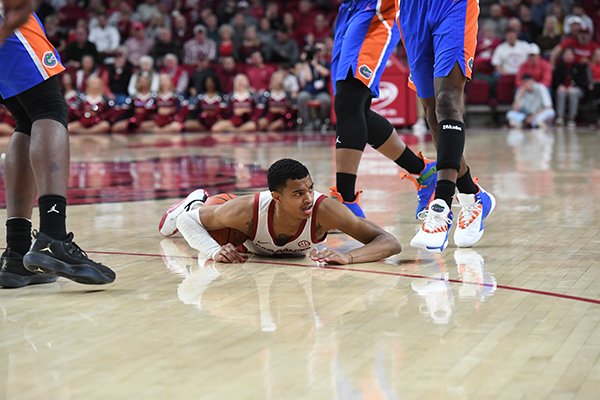 Arkansas guard Jalen Harris lays on the floor during a game against Florida on Wednesday, Jan. 9, 2019, in Fayetteville. 