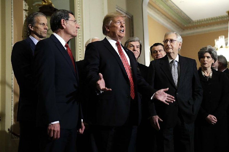 President Donald Trump, with Senate Majority Leader Mitch McConnell (second from right) and other GOP Senate leaders, said Wednesday that an emergency declaration to build a border wall is still a possibility. 