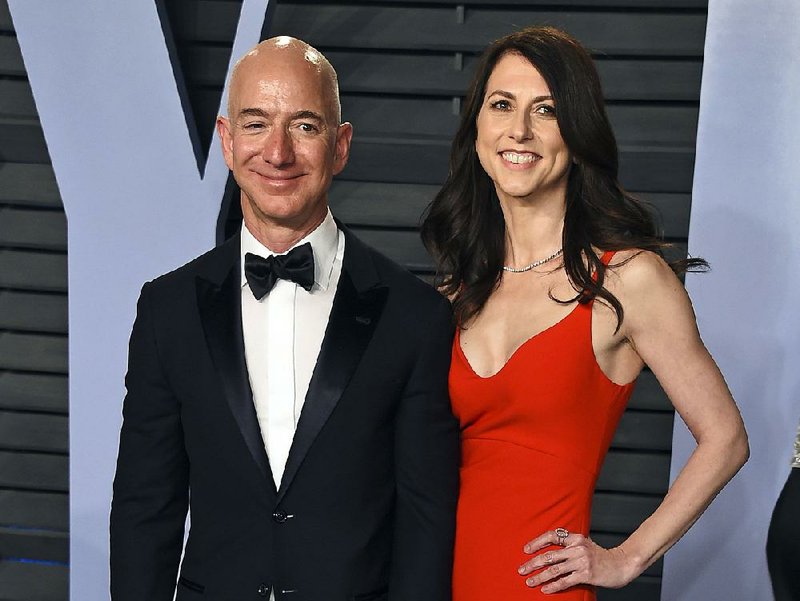 In this March 4, 2018 file photo, Jeff Bezos and MacKenzie Bezos arrive at the Vanity Fair Oscar Party in Beverly Hills, Calif.  