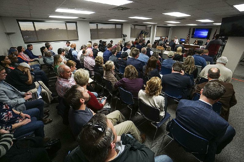 People fill the room Wednesday as the Arkansas Medical Marijuana Commission considers a consulting firm’s scores of applications for medical marijuana dispensaries. 