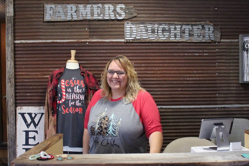 MEGAN DAVIS/MCDONALD COUNTY PRESS Tracy Owen, a farmer's daughter and owner of a boutique by the same name, outgrew her &quot;she-shed&quot; and upgraded to a newly remodeled location in Anderson. The shop occupies a storefront at 102 W. Walnut Street and the showroom is packed with customizable country couture at an affordable price.