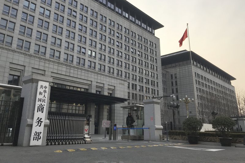 A Chinese paramilitary policeman stands guard at the main entrance gate of the Ministry of Commerce in Beijing, Wednesday, Jan. 9, 2019. U.S. and Chinese envoys extended trade talks into a third day Wednesday after President Donald Trump said negotiations aimed at ending a tariff war were &quot;going very well!&quot; (AP Photo/Oliver Zhang)