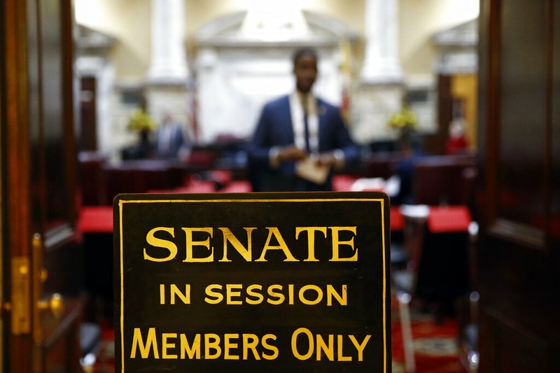 FILE - In this Wednesday, Jan. 9, 2019 file photo, a sign stands outside an entrance to the Maryland State Senate chamber in Annapolis, Md., on the first day of the state's 2019 legislative session. The U.S. Supreme Court has scheduled arguments in March 2019 on an appeal of a ruling that western Maryland's 6th Congressional District is an unconstitutional partisan gerrymander that diluted the voting power of Republicans. (AP Photo/Patrick Semansky)