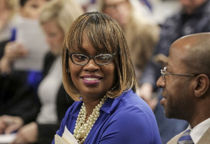 FILE - Pine Bluff Lighthouse Academy Director Lenisha Broadway Roberts (left) smiles after the state Board of Education granted a hearing for the charter school over whether to keep the school open. Khori Whittaker, president and chief executive officer of the national Lighthouse Academies network of charter schools, also expresses pleasure at the decision. 