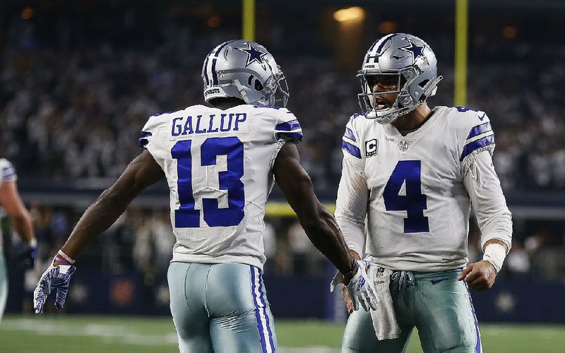 Dallas Cowboys quarterback Dak Prescott (4) congratulates Michael Gallup after they connected on a touchdown pass last week against Seattle. The Cowboys face the Los Angeles Rams on Saturday in the NFC divisional playoffs at the Los Angeles Memorial Coliseum, the site of Prescott’s NFL debut. 