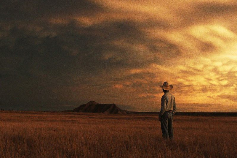 Brady Blackburn (Brady Jandreau) contemplates the wide skies of South Dakota in The Rider, one of the best films of 2018. 