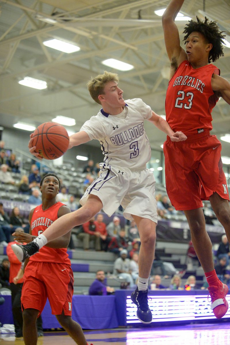 NWA Democrat-Gazette/ANDY SHUPE Fayetteville guard Connor Barnett (3) looks to pass around Fort Smith Northside forward Jaylin Williams in a game played earlier this season. Northside is 2-0 in the 6A-Central after winning its second consecutive road game Tuesday at Little Rock Central. The Grizzlies will host Little Rock Catholic tonight in their first home game of the season.