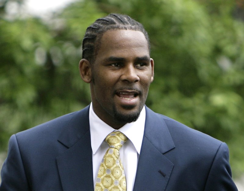 FILE - This June 13, 2008 file photo shows R&amp;B singer R. Kelly arriving at 3the Cook County Criminal Court Building in Chicago. Kelly, one of the top-selling recording artists of all time, has been hounded for years by allegations of sexual misconduct involving women and underage girls _ accusations he and his attorneys have long denied. But an Illinois prosecutor&#x2019;s plea for potential victims and witnesses to come forward has sparked hope among some advocates that the R&amp;B star might face new charges. (AP Photo/M. Spencer Green, File)