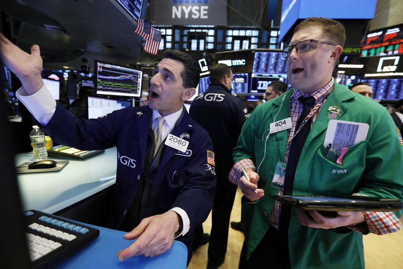 Specialist Peter Mazza, left, and trader Ryan Falvey work on the floor of the New York Stock Exchange, Thursday, Jan. 10, 2019. Stocks are slumping in early trading on Wall Street led by steep drops in Macy's and other retailers after several of the companies reported weak holiday sales. (AP Photo/Richard Drew)