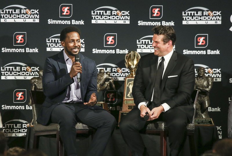 Special guest speaker Desmond Howard (left) talks with David Bazzel during the Little Rock Touchdown Club's Awards Banquet at the Embassy Suites Thursday, Jan 10, 2018 in Little Rock.