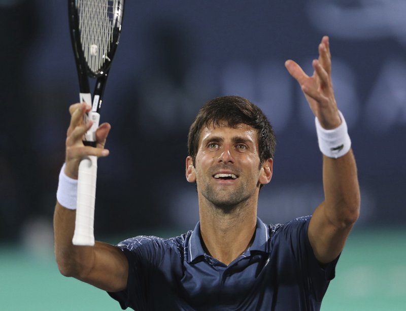 Serbia's Novak Djokovic celebrates after he defeated South Africa's Kevin Anderson in the final match of the Mubadala World Tennis Championship in Abu Dhabi, United Arab Emirates, Saturday, Dec. 29, 2018. 