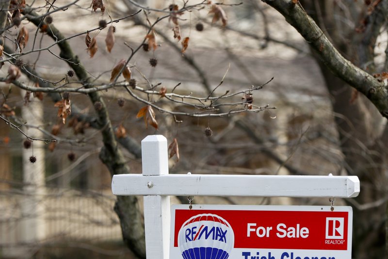 In this Jan. 3 file photo, a realtor sign marks a home for sale in Franklin Park, Pa. The partial federal government shutdown is complicating the already complicated process of getting and managing a mortgage. For one thing, the political storm is like severe weather at a major airport: You can expect minor delays or worse. Also, it could mean financial hardship for some federal government employees facing mortgage payments without their regular paychecks. (AP Photo/Keith Srakocic)

