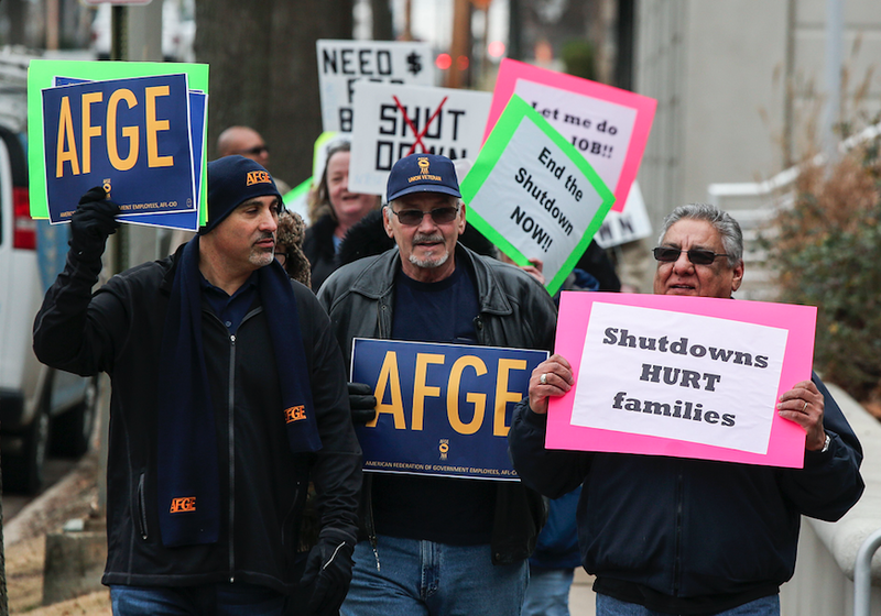 Arkansas Democrat-Gazette/MITCHELL PE MASILUN -- 1/11/2019 --
Union members protest the government shutdown outside the Victory Building, which houses the offices of Sens. Cotton and Boozman, Friday, Jan 11, 2018 in Little Rock.
