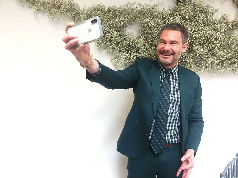 Bronson van Wyck, the major New York event planner, takes a selfie by a baby’s breath display, after speaking in Washington, D.C. on Friday. 