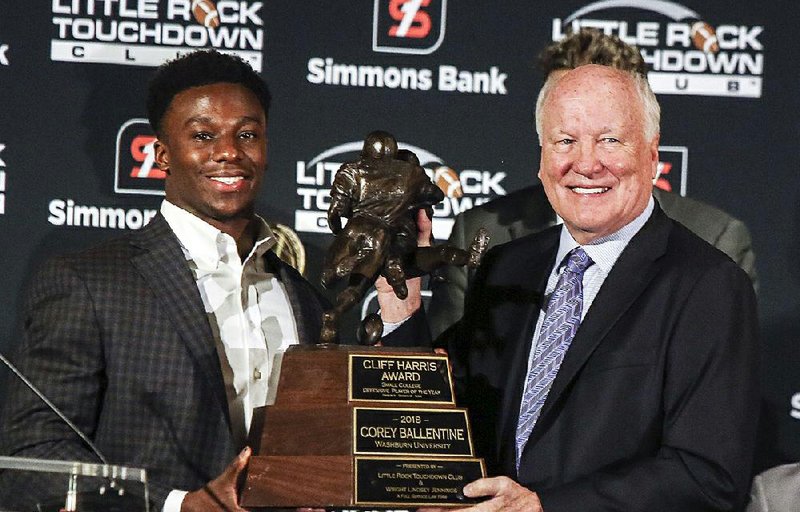 Corey Ballentine (left), a defensive back for Division II Washburn (Kan.) University, was named the recipient of the Cliff Harris Award for the nation’s top small college defensive player at the Little Rock Touchdown Club banquet Thursday. Presenting the award is its namesake, a former Dallas Cowboys and Ouachita Baptist defensive back. More photos at arkansasonline.com/galleries 