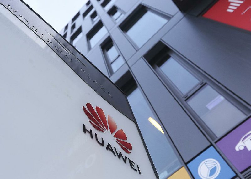 The Huawei logo is displayed Friday at the Warsaw, Poland, branch headquarters of the Chinese tech giant. 