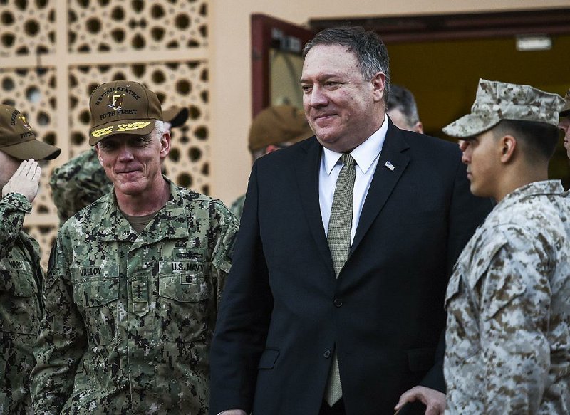 U.S. Secretary of State Mike Pompeo (center) walks Friday with Vice Adm. James Malloy, commander of the U.S. Naval Forces Central Command/5th Fleet, after a tour of the U.S. Naval Forces Central Command center in Manama, Bahrain. 