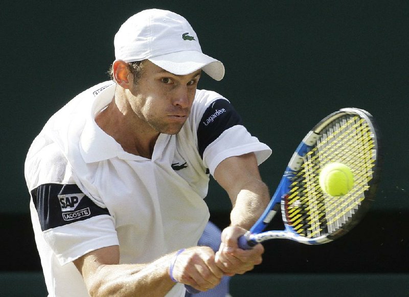 Andy Roddick plays a return to Roger Federer during their Wimbledon men’s final match in 2009. Roddick lost the match, which went to 16-14 in the fifth set. Each Grand Slam tournament now will resolve their lengthiest matches in a unique way. 