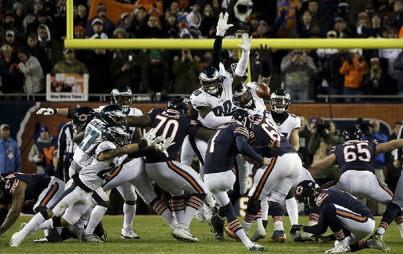 Philadelphia lineman Treyvon Hester (middle) tipped Chicago kicker Cody Parkey’s field goal attempt just enough to send the ball bouncing off the upright and crossbar, securing the Eagles’ 16-15 victory over the Bears last week. 