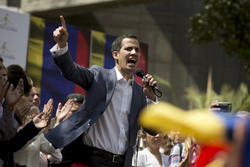 Juan Guaido, President of the Venezuelan National Assembly delivers a speech during a public session with opposition members, at a street in Caracas, Venezuela, Friday, Jan. 11, 2019. The head of Venezuela's opposition-run congress says that with the nation's backing he's ready to take on Nicolas Maduro's presidential powers and call new elections.