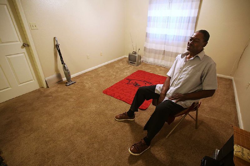 Theodore Thompson sits Friday in the empty North Little Rock apartment he moved into recently. Thompson is caught in a series of legal and emotional battles with his former landlord, Imran Bohra, who Thompson says seized his belongings in an eviction dispute. “It’s hard for me to understand how I’m not the first, and if he’s not stopped, I definitely won’t be the last,” Thompson said. 