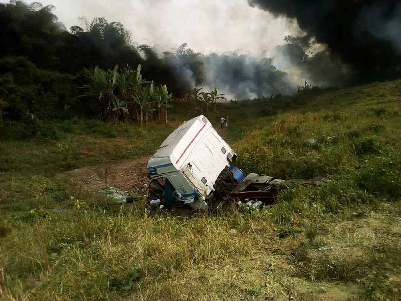 People gather Friday near the site where an oil tanker exploded in Odukpani, Nigeria. 