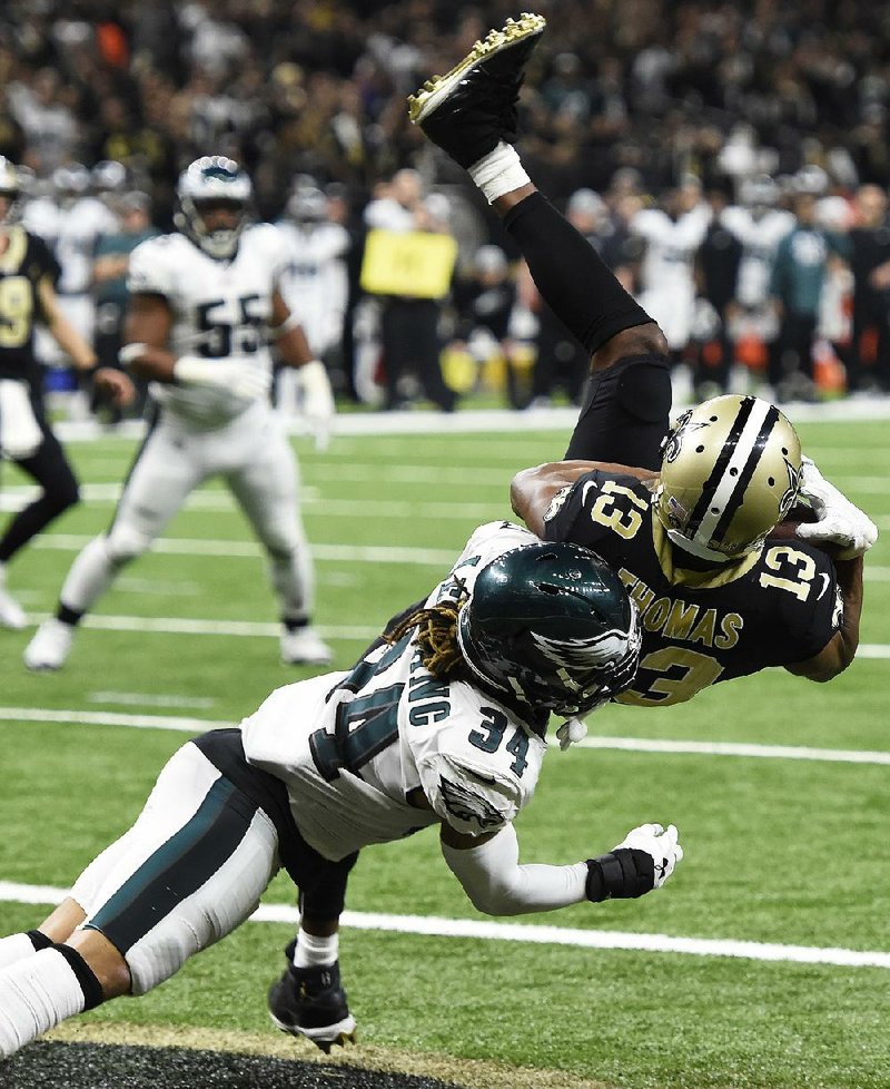 New Orleans Saints wide receiver Michael Thomas pulls in a touchdown reception as Philadelphia Eagles cornerback Cre’von LeBlanc defends in the second half of Sunday’s NFC divisional playoff game in New Orleans. Thomas caught 12 passes for 171 yards and a touchdown as the Saints won 20-14.