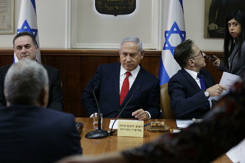 Israeli Prime Minister Benjamin Netanyahu holds his weekly Cabinet meeting Sunday in Jerusalem, announcing strikes on Iranian and Hezbollah sites in Syria while praising his departing military chief of staff. 