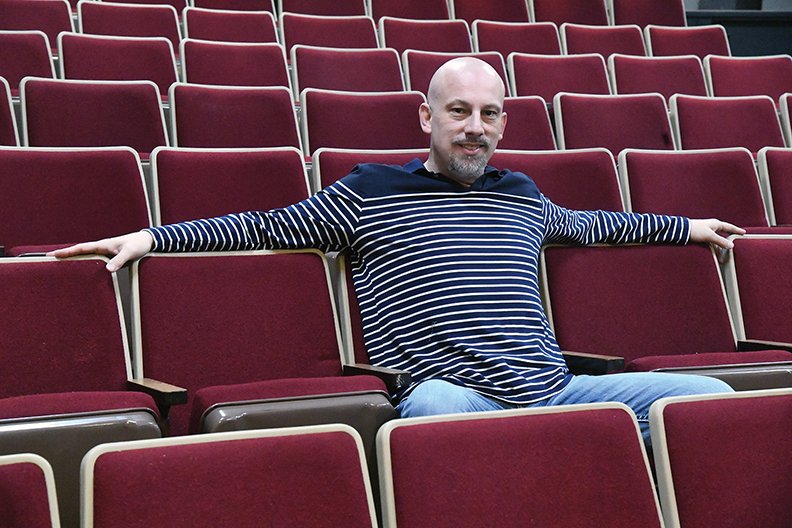 The Sentinel-Record/Grace Brown- Newly elected board president of the Pocket Theatre has his photo taken while sitting in the newly installed chairs at the Pocket Theatre on Saturday, January 12, 2019. 