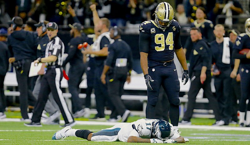 The Associated Press NO REPEAT: Philadelphia Eagles receiver Alshon Jeffery (17) lies on the turf at the Superdome in New Orleans on Sunday in front of defensive end Cameron Jordan (94) after his dropped pass was intercepted, allowing the Saints close out a 20-14 win in the divisional round of the NFL playoffs.