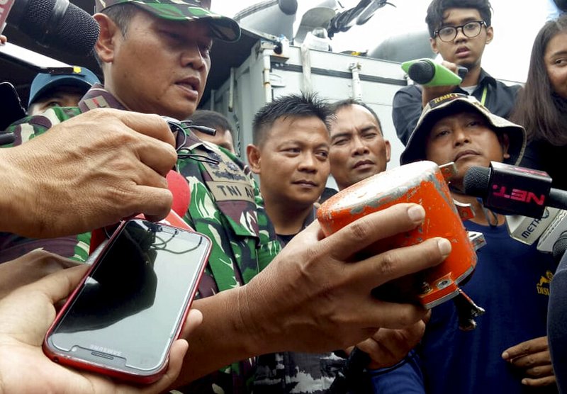 Indonesian Navy Commander Rear Admiral Yudo Margin shows the recovered cockpit voice recorder of Lion Air flight 610 that crashed into the sea in October during a press conference on board of the navy ship KRI Spica in the waters off Tanjung Karawang, Indonesia, Monday, Jan. 14, 2019. Navy divers have recovered the cockpit voice recorder in a possible boost to the accident investigation. (AP Photo/Achmad Ibrahim)